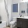 Bathroom with large mirror and vanity