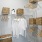 a walk-in closet with wire shelving and baskets