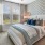 Bedroom with natural lighting and high ceilings