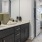Spacious, well-lit bathroom with a large missor and vanity